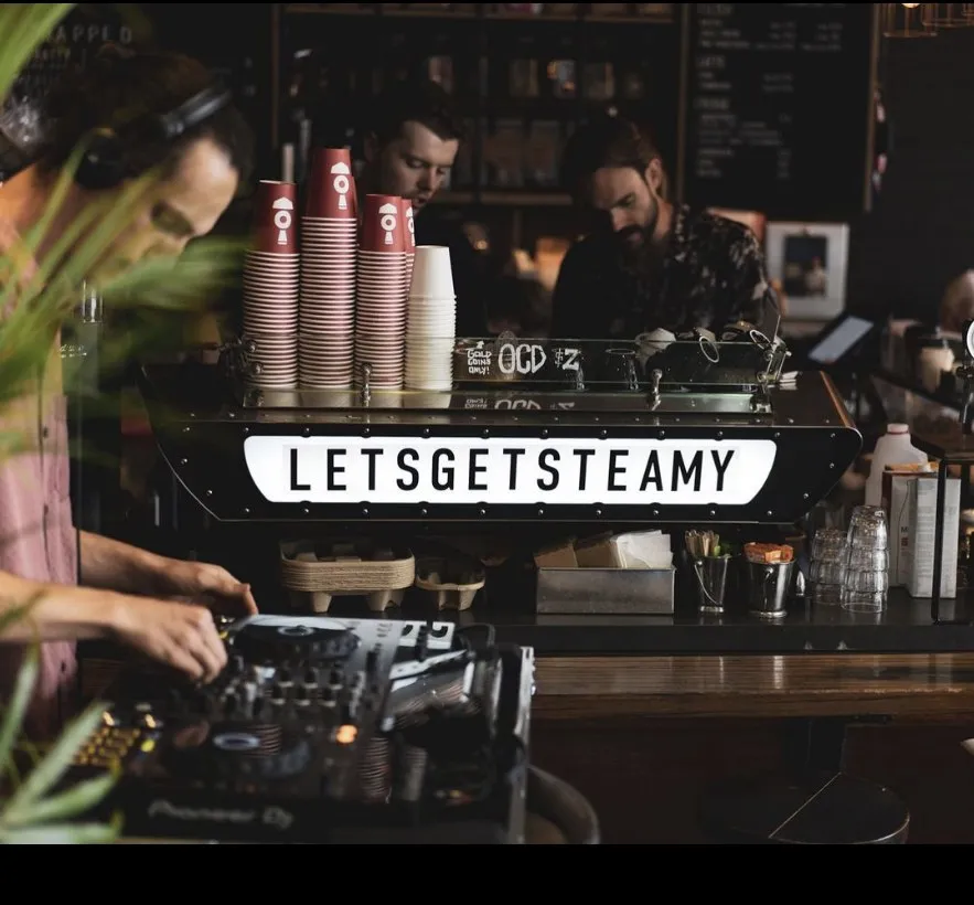 The Steam Engine bar with the lit LETSGETSTEAMY sign
